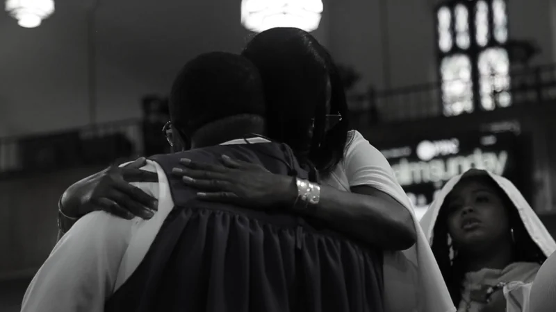 People embracing at Paseo Baptist Church